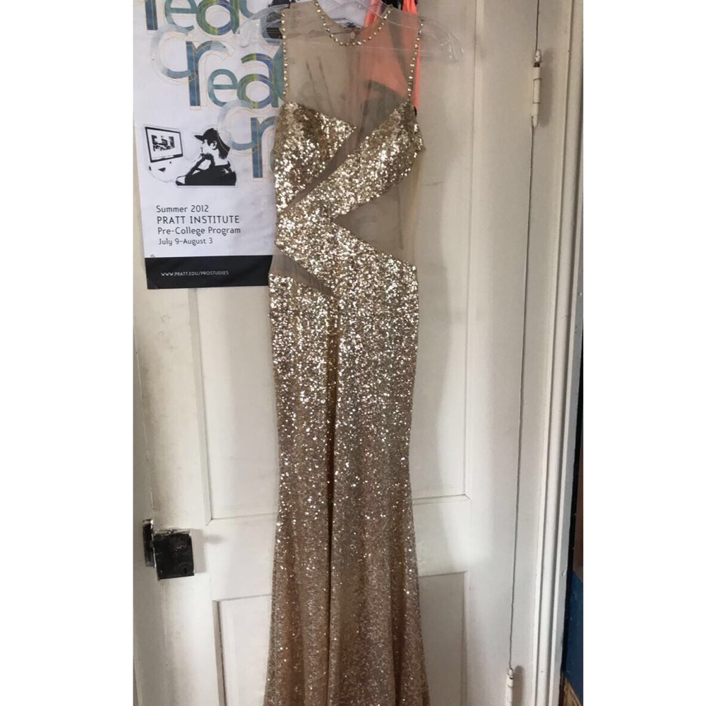 Gold sequin dress with cutouts.